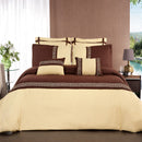 Gold and brown bedspread set with matching pillows in a bedroom setting.