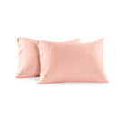 Two blush pink pillowcases shown on a plain white background.
