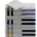 Stack of striped bed sheets in various colors on a white background