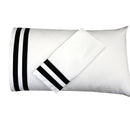 White pillowcases with black stripes on a white background