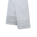 White pillowcases with decorative pleats on a white background