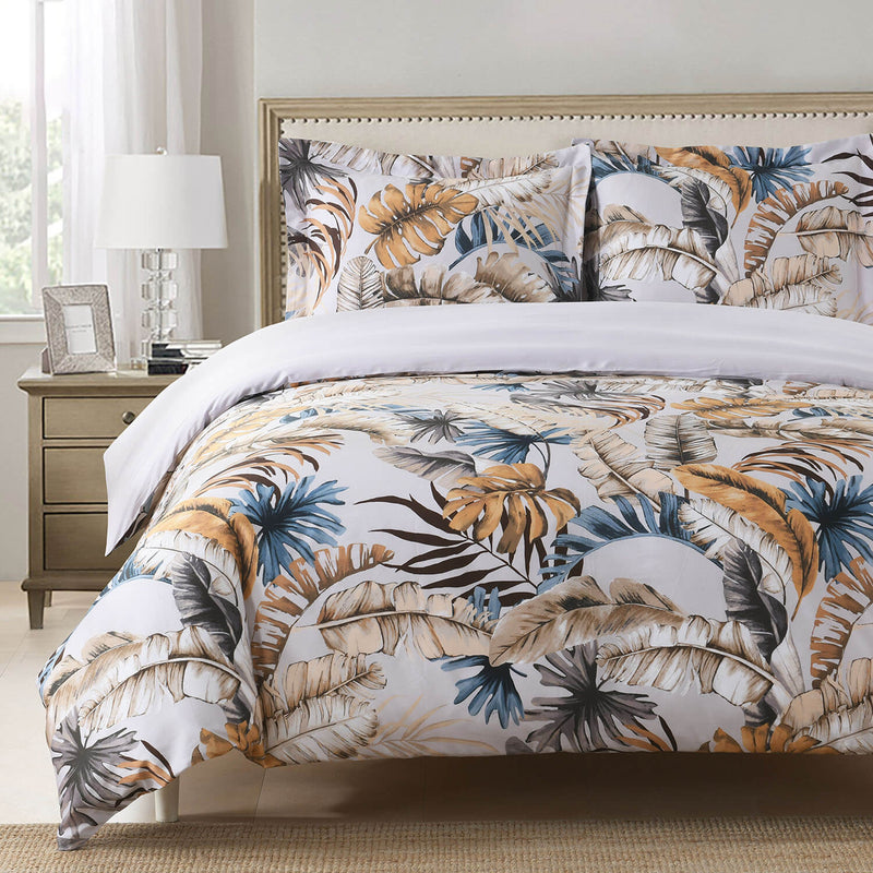 Warm tropical leaves print. 100% Cotton Duvet Cover Set with shams. Available in sizes Twin/Twin XL, Full/Queen, King/Cal King