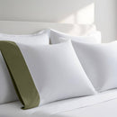 Pillow case with Sage color cuff displayed on a bed with white bedding