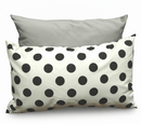 Gray pillow and white pillow with black polka dots on a white background