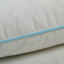 Close-up of a quilted pillow stylish blue pipping